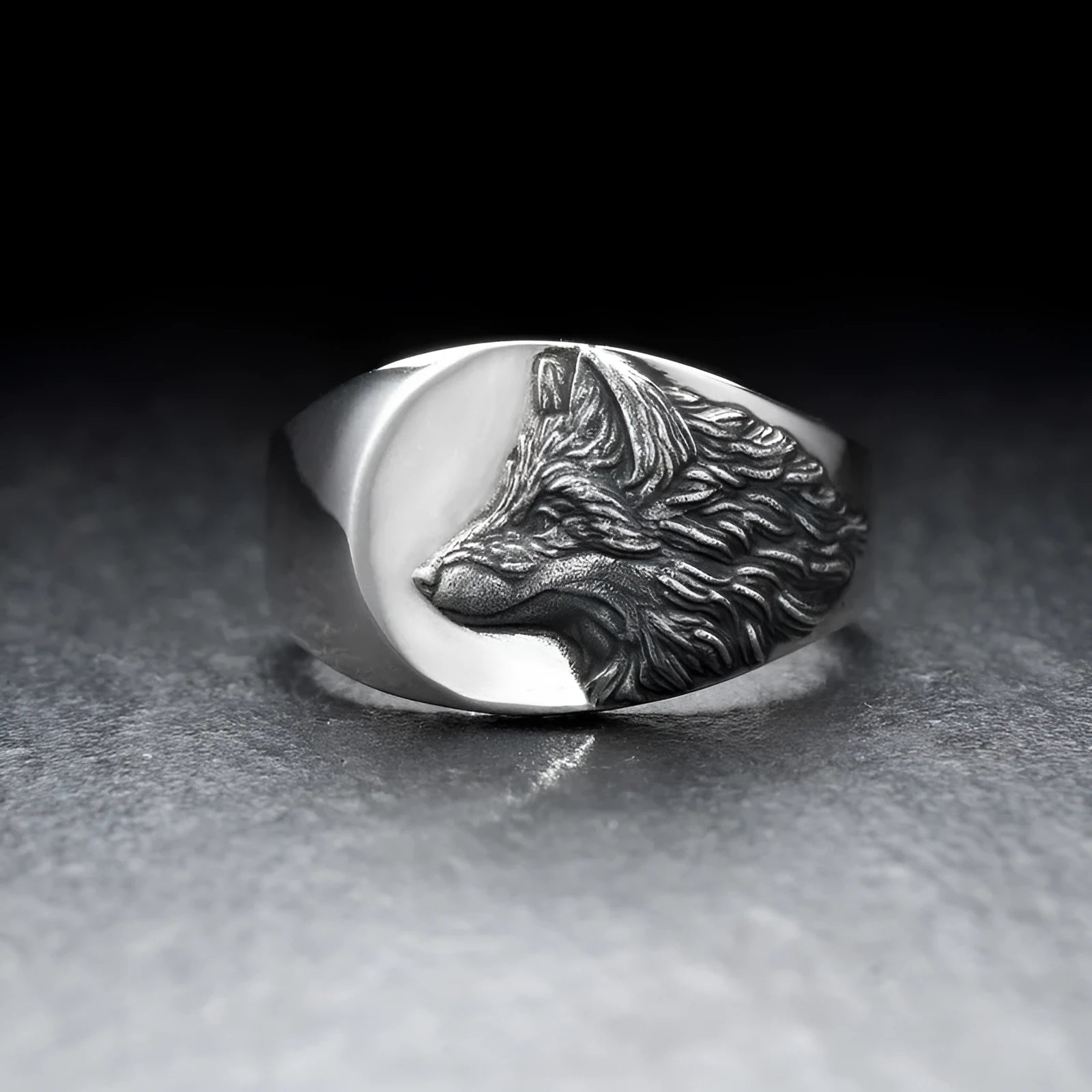 Men's silver alloy ring with a geometric wolf head design on a signet ring band.