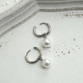 Women's alloy pearl geometric earrings with titanium steel posts and round design