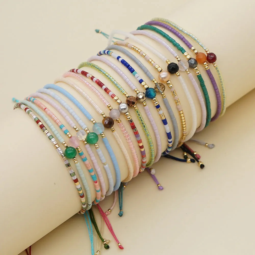 Women's handmade Bohemian bracelet with colourful geometric glass beads.