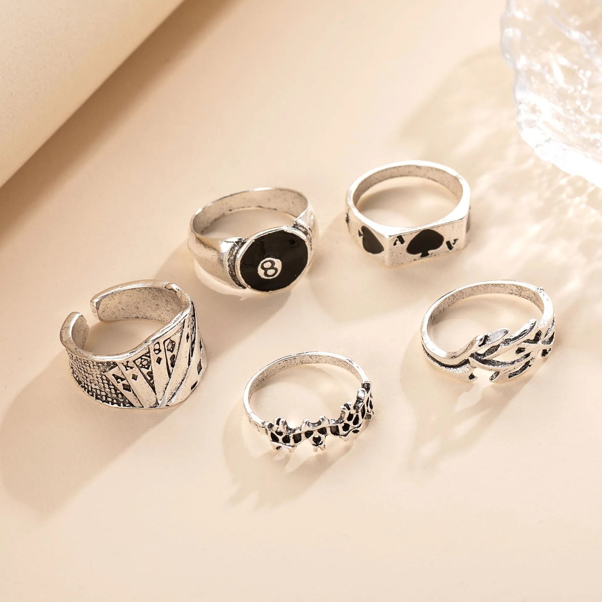 Black alloy ring with a raised spade card design on a band for women.