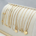 Set of ten gold electroplated women's necklaces with snake bone chains and alloy pendants.
