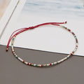 Women's handmade Bohemian bracelet with colourful geometric glass beads.