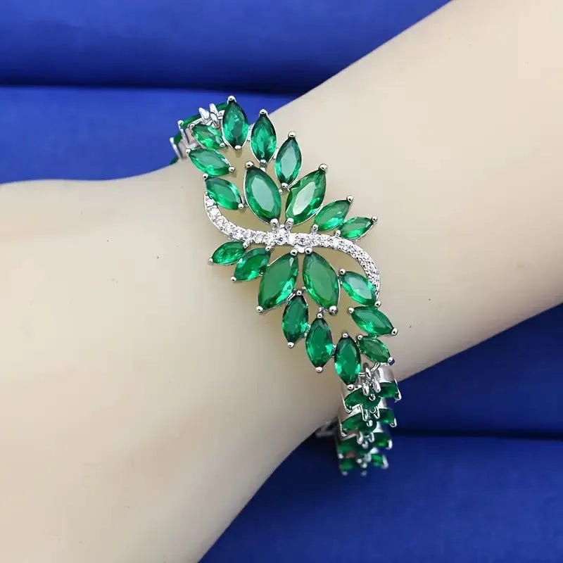 Gold electroplated bracelet with coloured zircon stones and ice flowers pattern on copper.