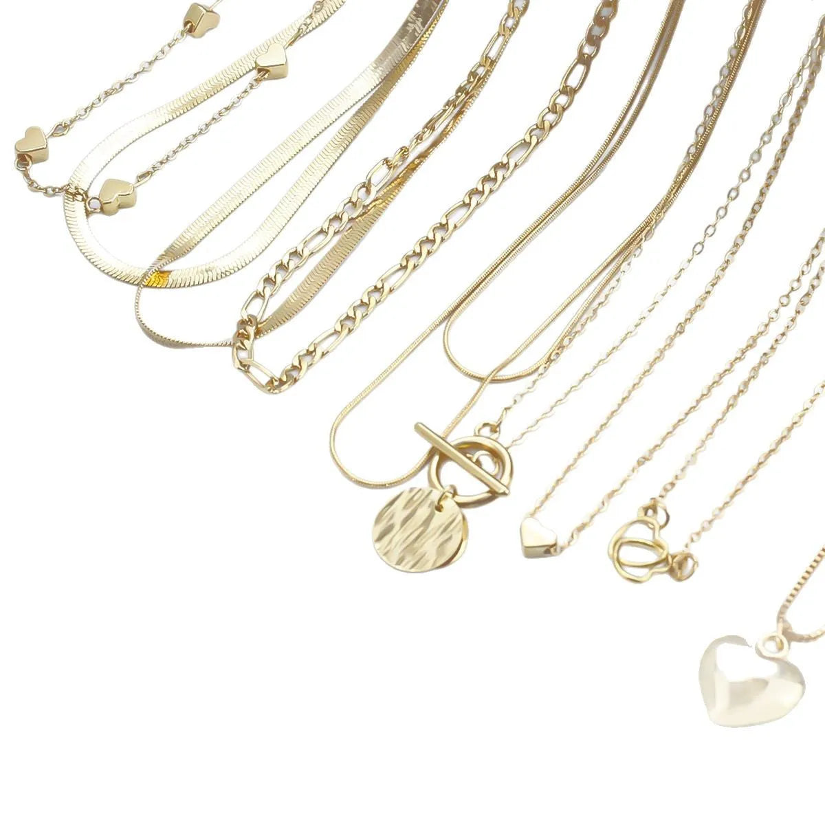 Set of ten gold electroplated women's necklaces with snake bone chains and alloy pendants.