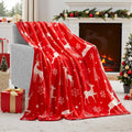 Soft red polyester flannel Christmas blanket draped over a sofa