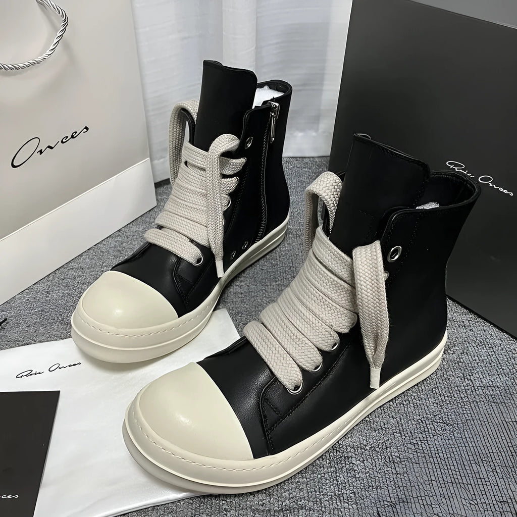 Black genuine leather high-top sneakers with side zipper and platform sole.