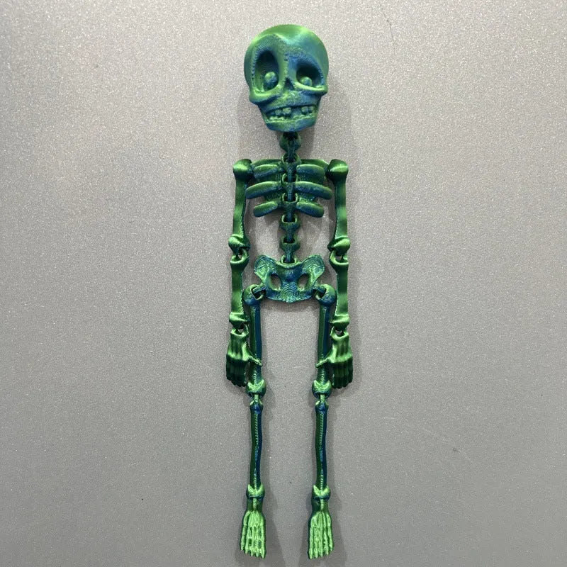 3D-printed white skull refrigerator magnet, 18cm tall, on a fridge door.