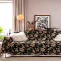American country retro jacquard sofa cover in a cherry pattern on a white background, draped over a sofa.