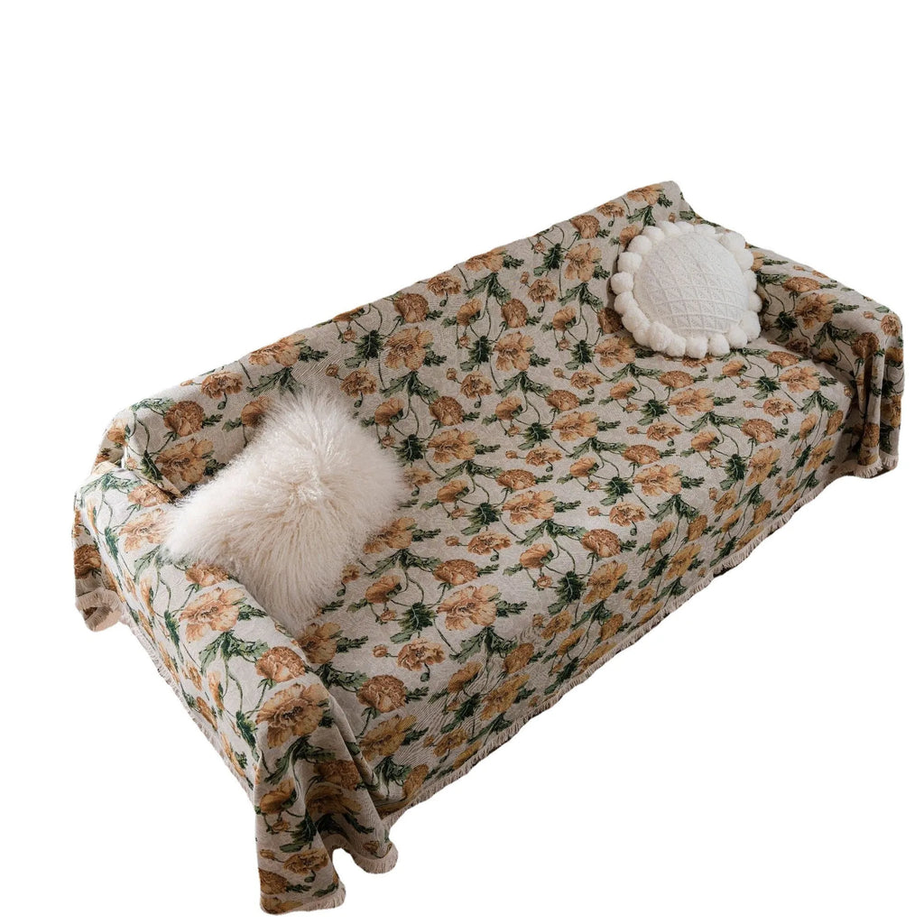 American country retro jacquard sofa cover in a cherry pattern on a white background, draped over a sofa.