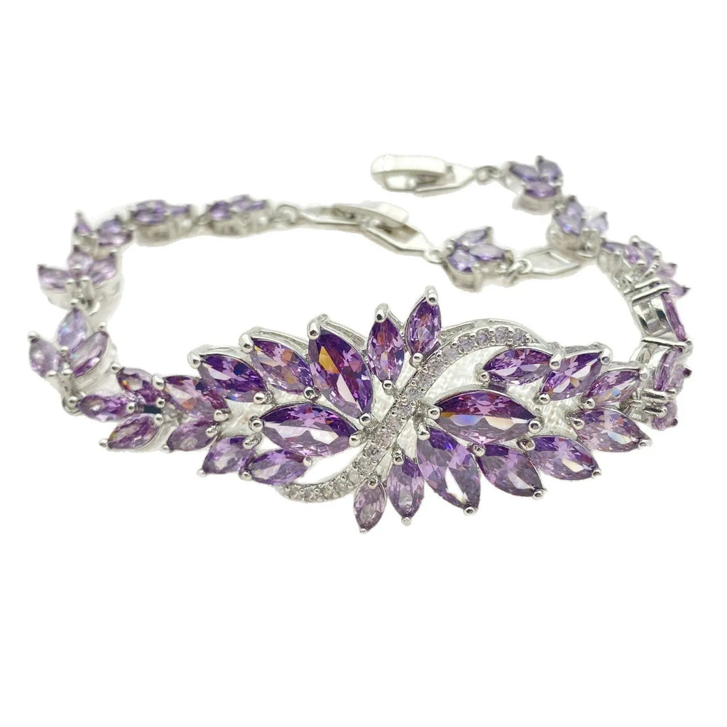Gold electroplated bracelet with coloured zircon stones and ice flowers pattern on copper.