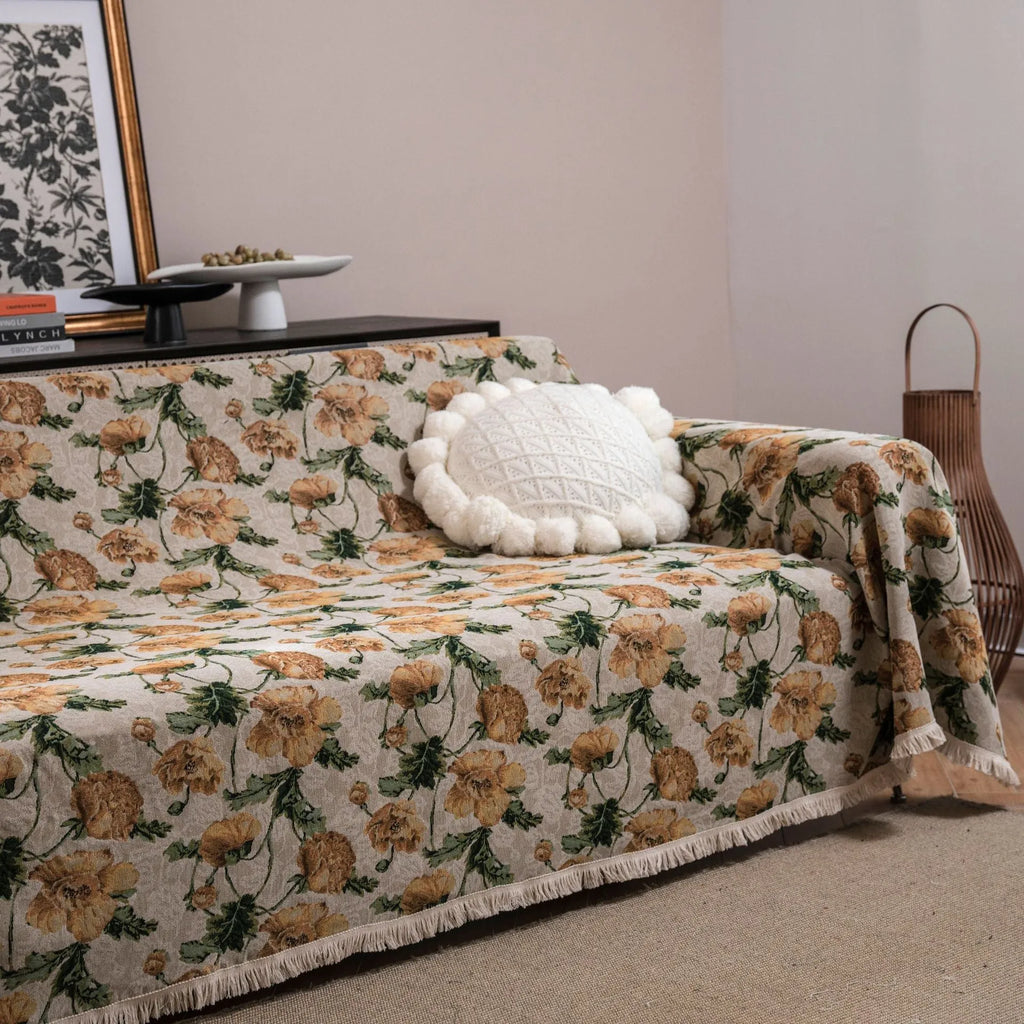American country retro jacquard sofa cover in a cherry pattern on a white background, draped over a sofa.
