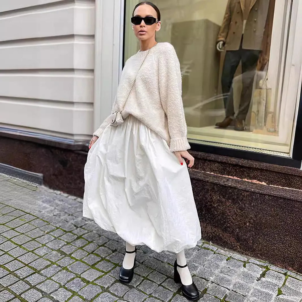 Women's solid colour cotton long skirt shown in black and white options