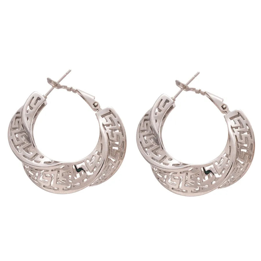 Twisted geometric hollow stud earrings in gold or silver finish with exaggerated round design