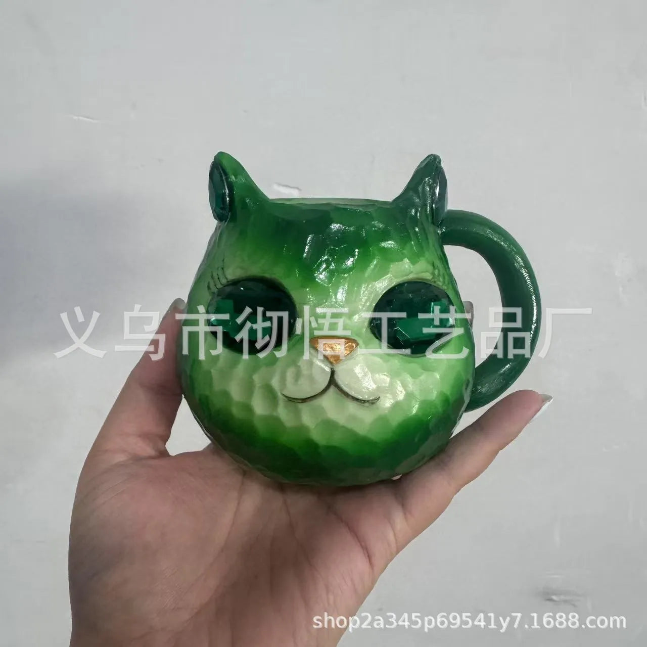 Clear resin Cat Cup ornament in purple, green, blue, and pink colour options on display.