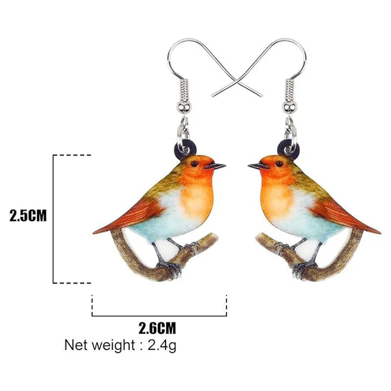 Acrylic blue titmouse bird and snake design pendant earrings on a white background.