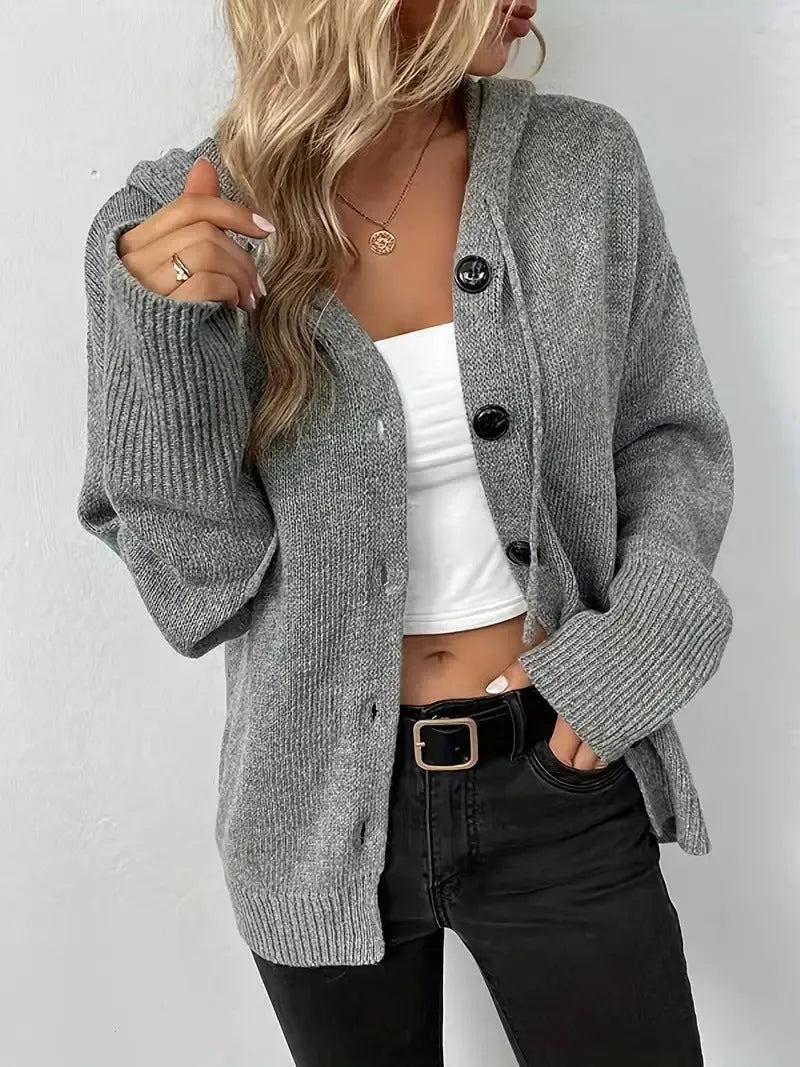 A thick grey hooded cotton cardigan with a raised 3D pattern, shown on a model.