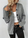A thick grey hooded cotton cardigan with a raised 3D pattern, shown on a model.