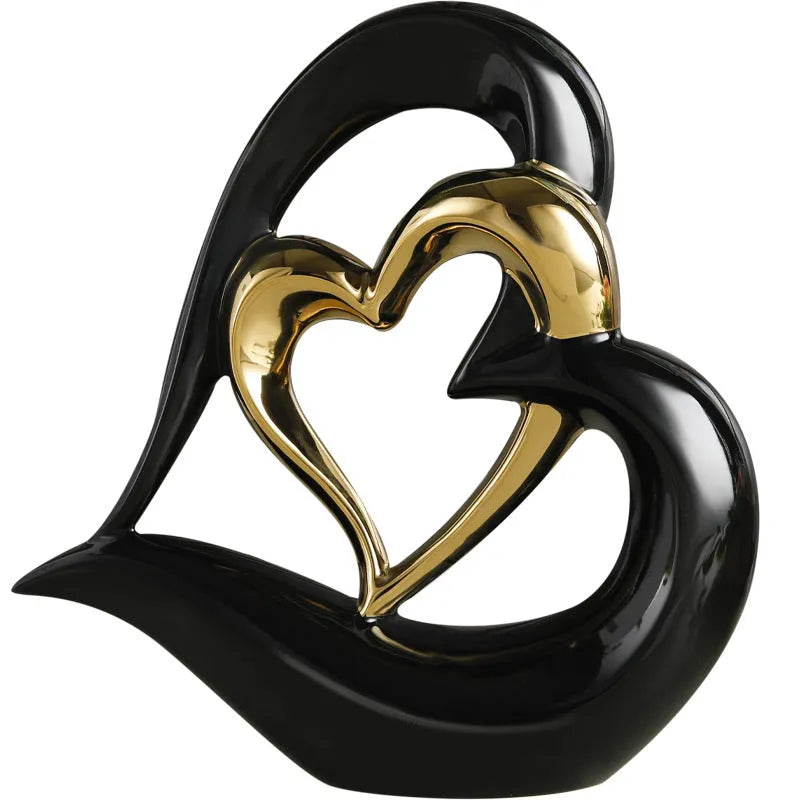 Modern white porcelain heart ornament with a geometric shape on a wooden surface.