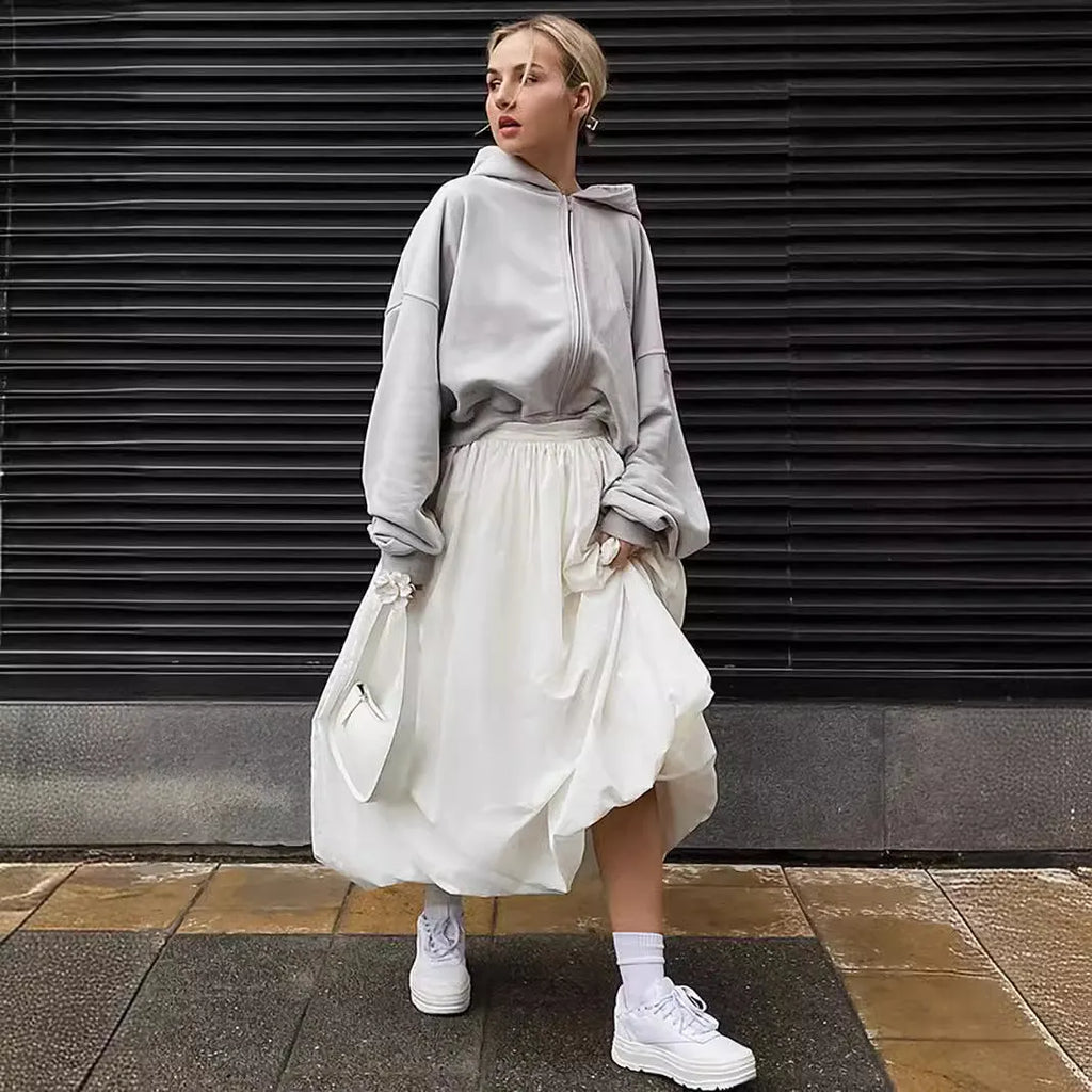 Women's solid colour cotton long skirt shown in black and white options