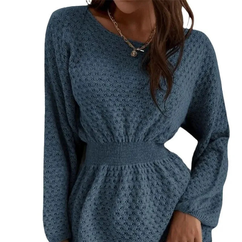 Blue women's knitted dress with hand-crocheted floral details, a round neck, and a fitted waist.