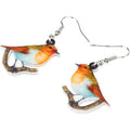 Acrylic blue titmouse bird and snake design pendant earrings on a white background.