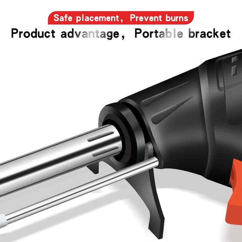 Black G102 alloy soldering gun with light from a five piece tool kit on a workbench.