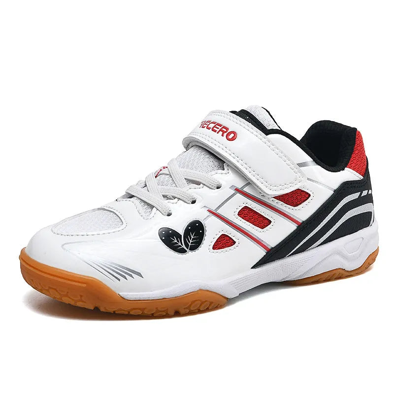 White and blue lightweight badminton shoes with a ribbed non-slip sole, shown on a court surface.