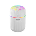 Small green animal-shaped USB aromatherapy humidifier on a desk