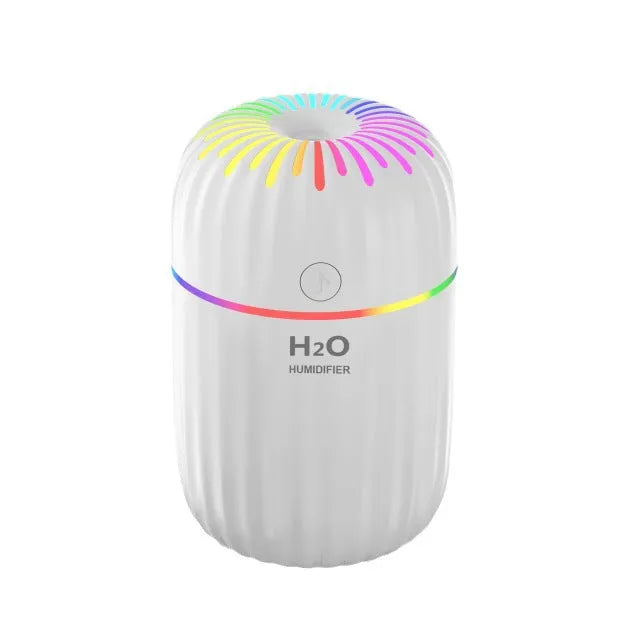 Small green animal-shaped USB aromatherapy humidifier on a desk