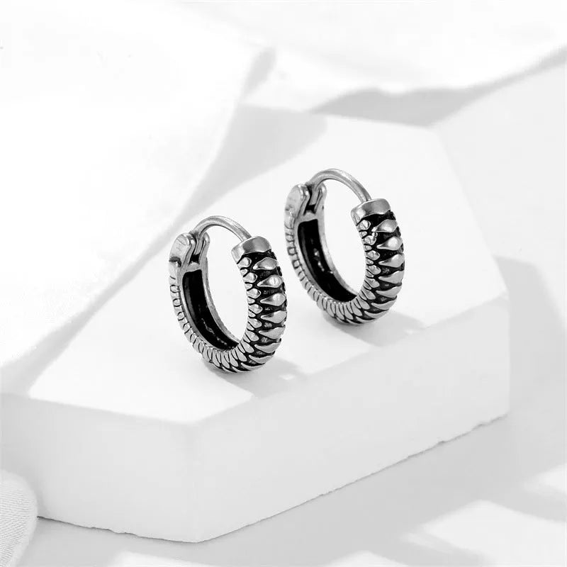 Geometric round stainless steel earrings with retro striped pattern in silver colour