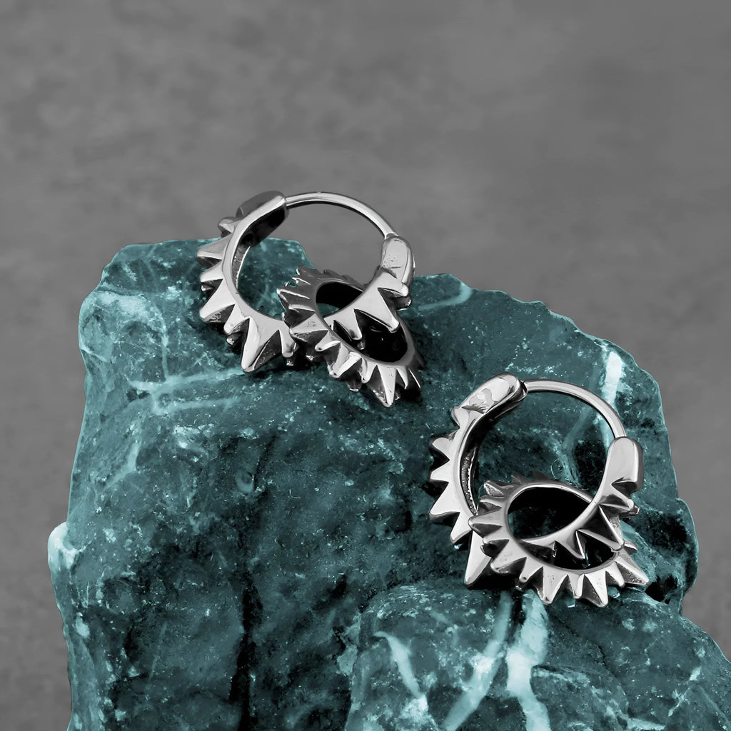 Stainless steel round hoop earrings with polished steel finish and retro design