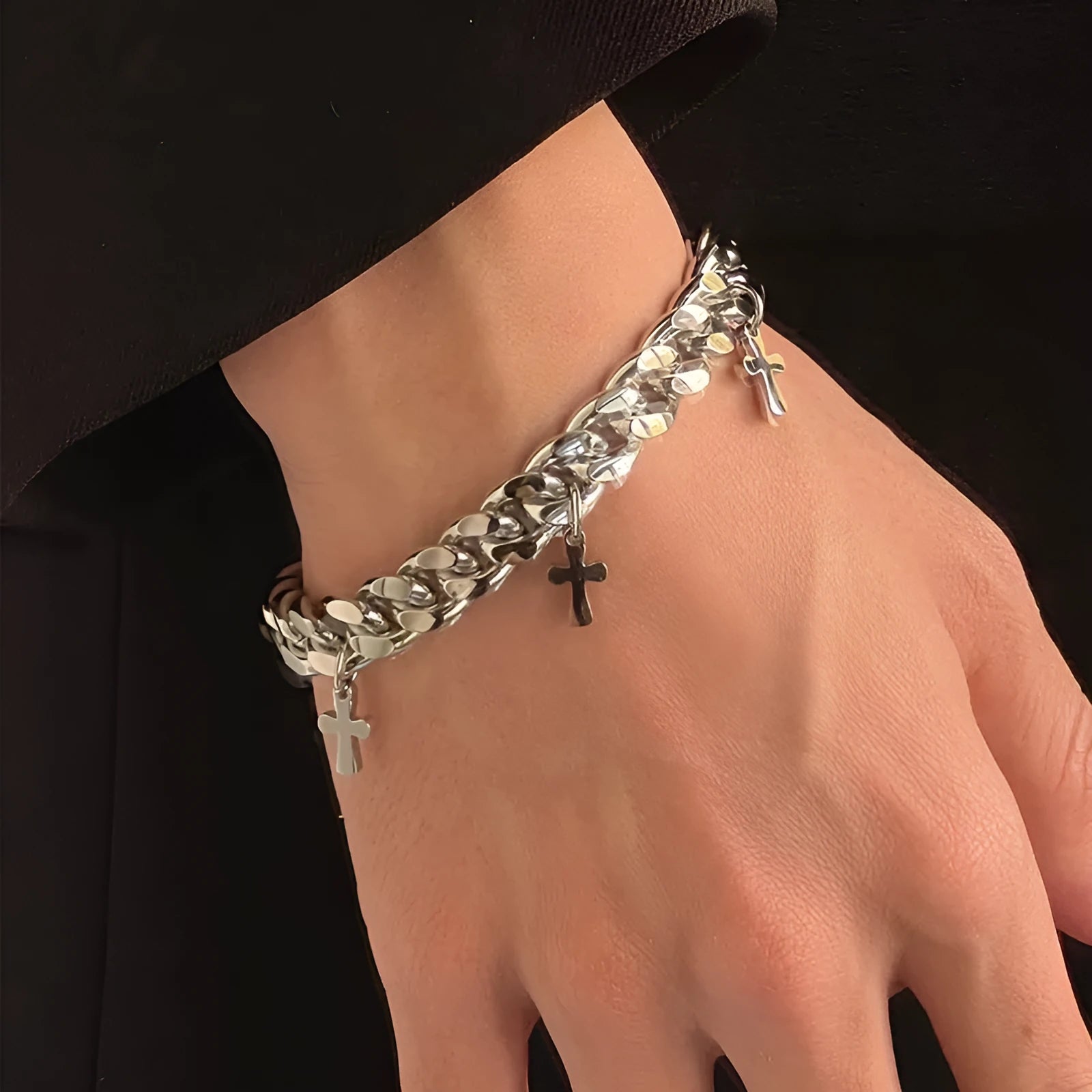 Men's titanium steel bracelet showing a geometric cross design on a simple band.