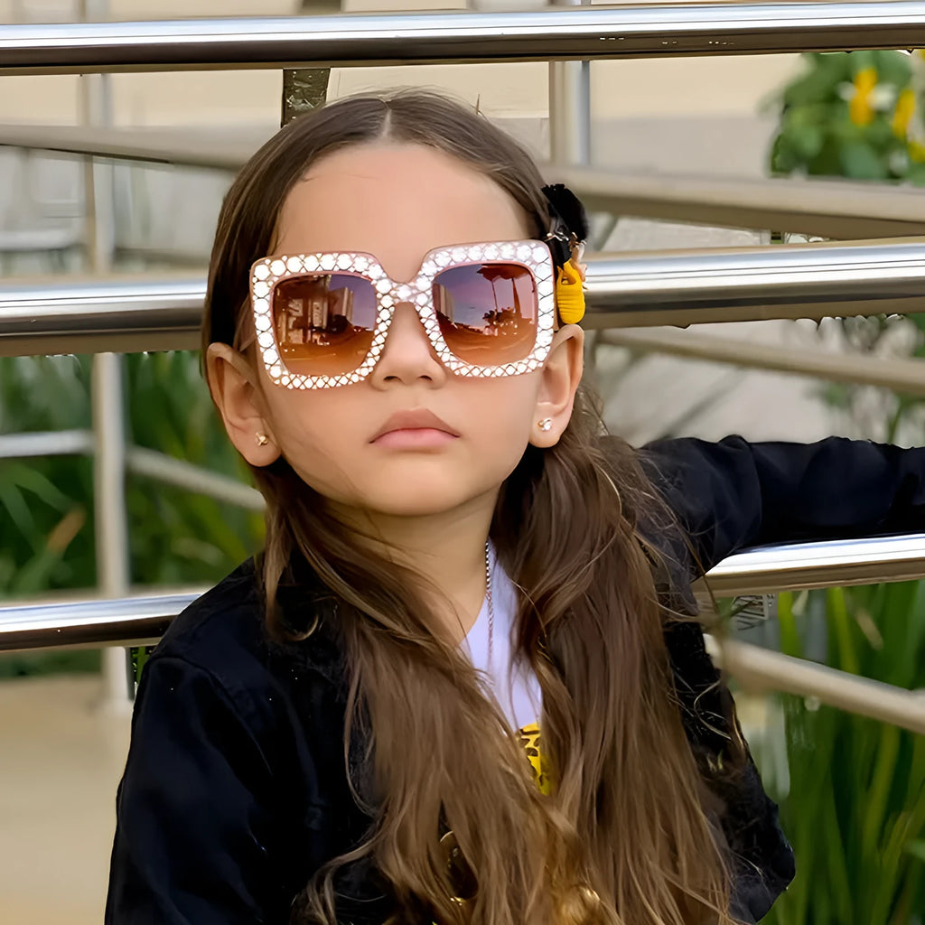 Plastic fashion sunglasses in various colour and lens combinations on a plain background.