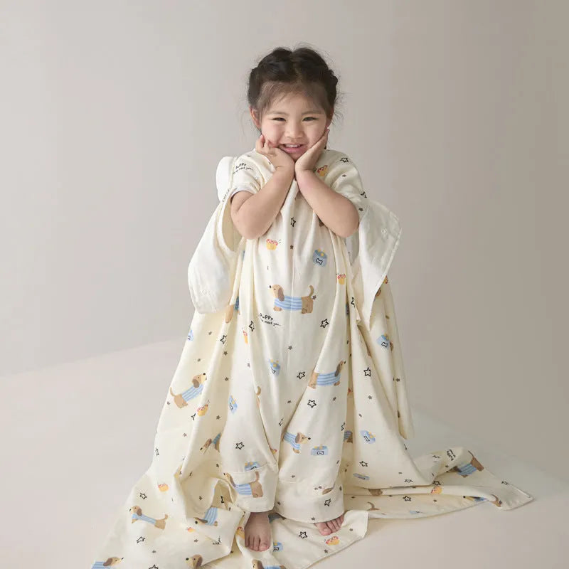 Anti-kick sleeping bag style blanket in a colourful pattern on a bed.