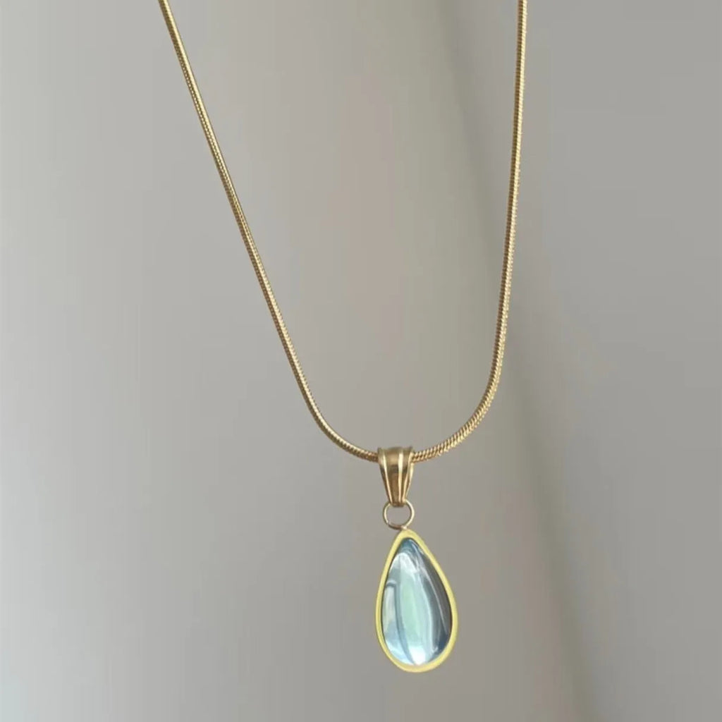 Retro women's water drop necklace with mixed gem inlay on a snake bones chain, in blue or green.