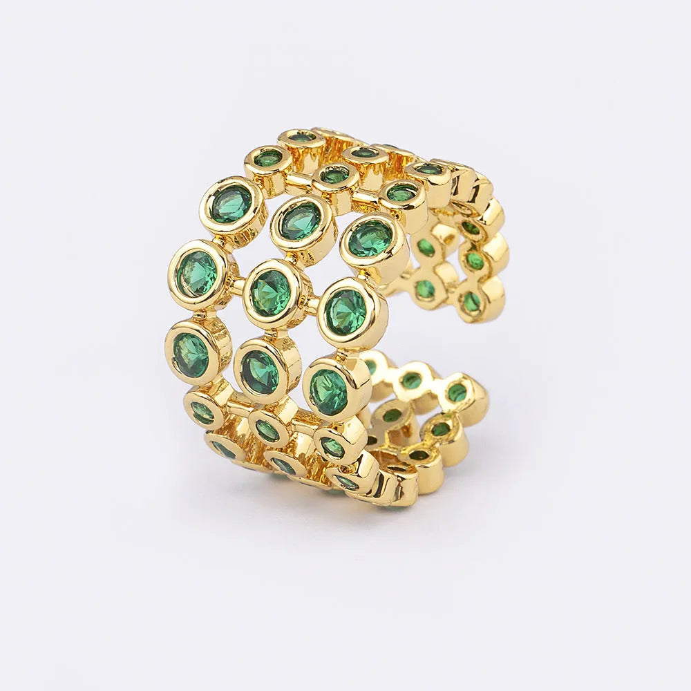 Copper ring with 18K gold plating and green zircon stones in wide band design