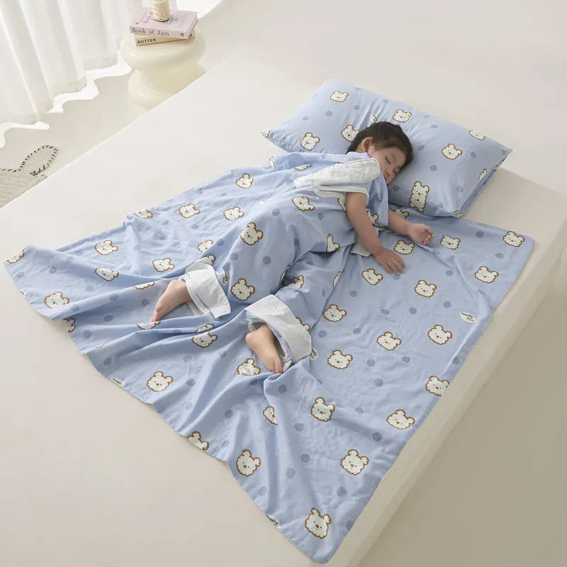 Anti-kick sleeping bag style blanket in a colourful pattern on a bed.