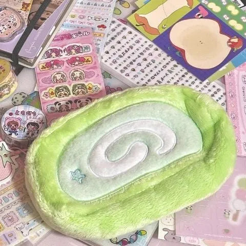 Velvet pencil case in Swiss roll cake design with zip closure for stationery storage