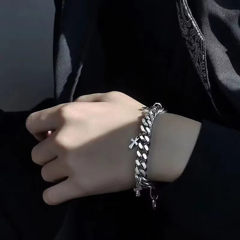 Men's titanium steel bracelet showing a geometric cross design on a simple band.