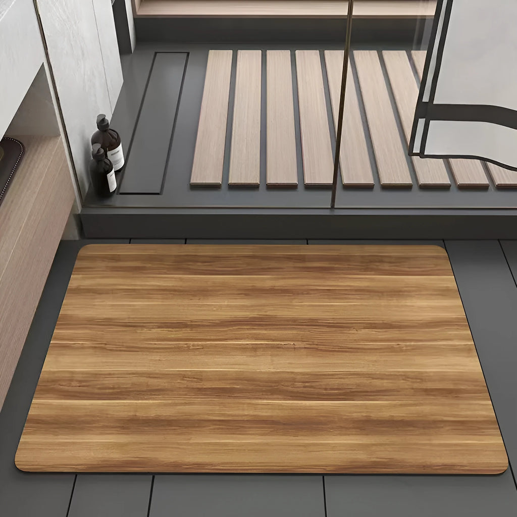 Square American wood grain patterned diatom ooze bathroom floor mat on a tiled floor.
