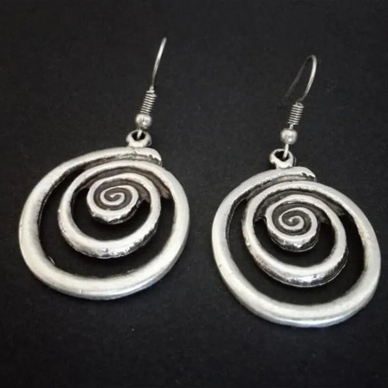 Silver geometric spiral distressed alloy earrings with national style design measuring 2.6 cm wide by 5 cm long