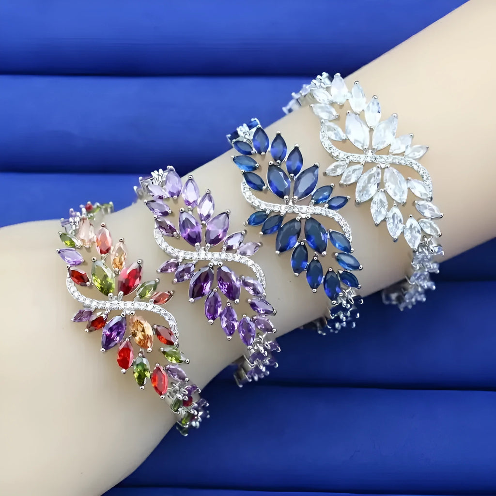 Gold electroplated bracelet with coloured zircon stones and ice flowers pattern on copper.