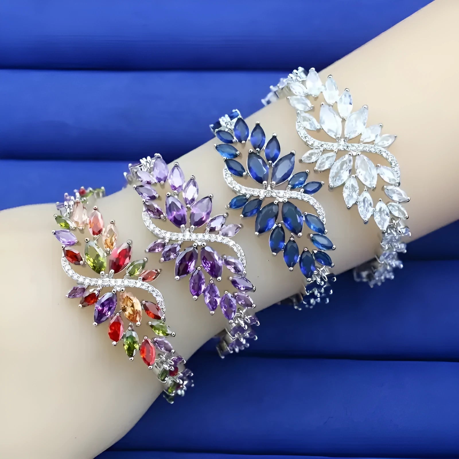 Gold electroplated bracelet with coloured zircon stones and ice flowers pattern on copper.