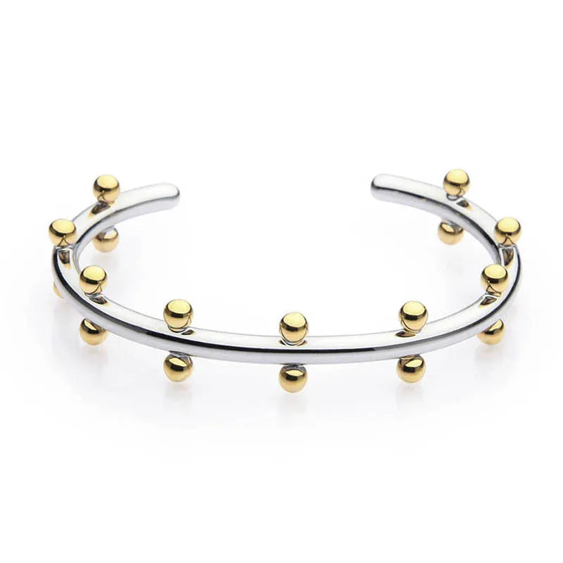 Stainless steel C-shaped bean bead bracelet with textured rivet design in gold and steel colours