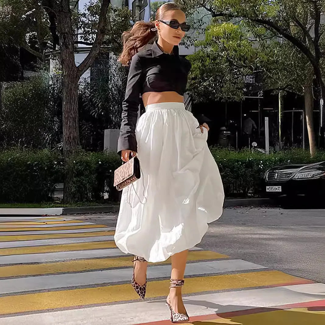 Women's solid colour cotton long skirt shown in black and white options