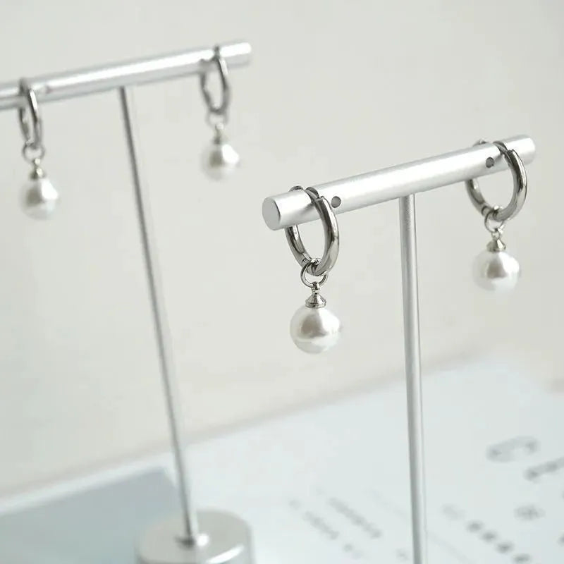 Women's alloy pearl geometric earrings with titanium steel posts and round design