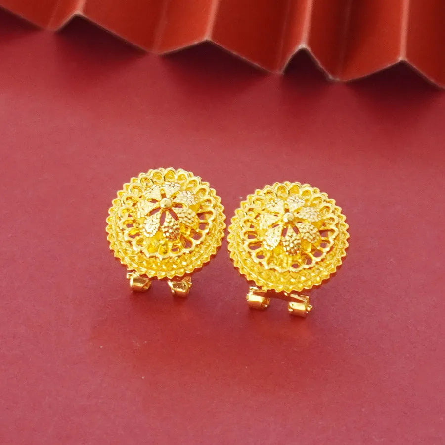 Gold-plated three-piece jewellery set with necklace, earrings, and ring featuring floral design patterns