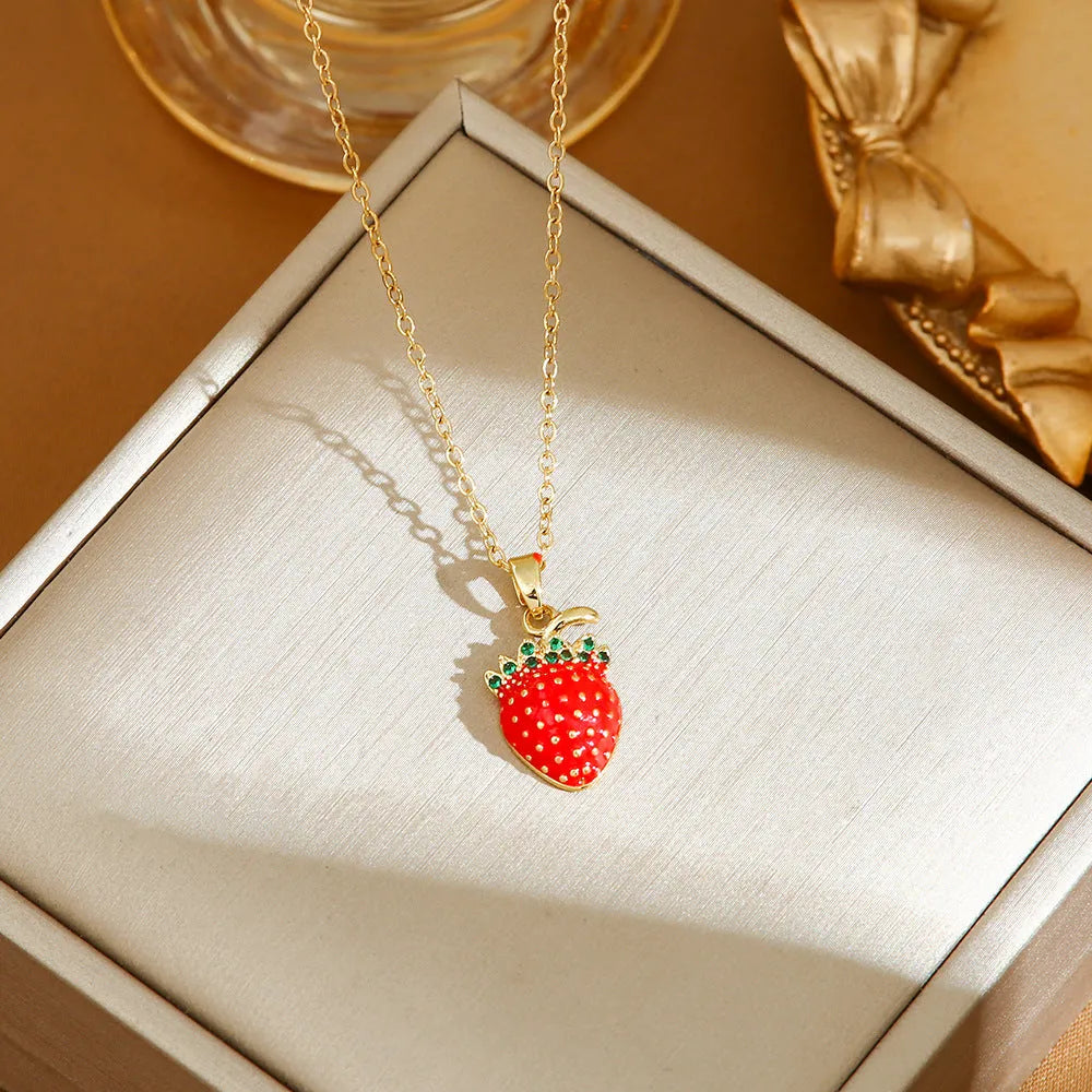 Titanium steel delicate necklace with indie cherry, strawberry, and pepper charms on an O-ring chain, shown in golden and steel colour variations.