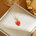 Titanium steel delicate necklace with indie cherry, strawberry, and pepper charms on an O-ring chain, shown in golden and steel colour variations.