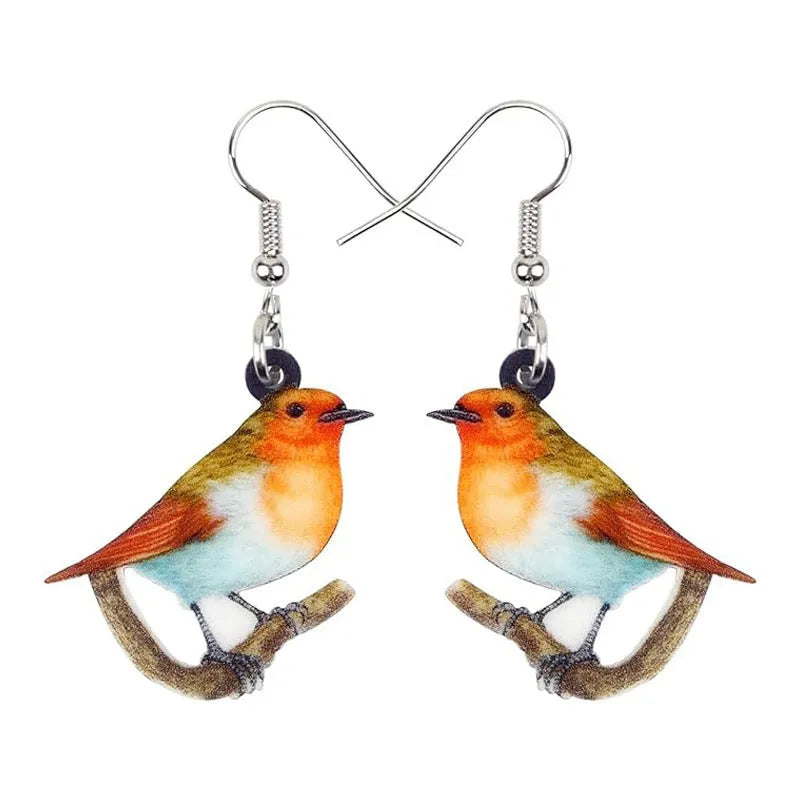 Acrylic blue titmouse bird and snake design pendant earrings on a white background.